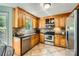 Well-maintained kitchen featuring stainless steel appliances and tile backsplash at 9517 Harris Glen Dr, Charlotte, NC 28269