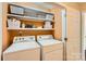 Bright laundry room with shelving, washer and dryer at 9517 Harris Glen Dr, Charlotte, NC 28269