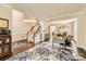 Cozy living area showcasing hardwood floors, staircase and natural light at 9517 Harris Glen Dr, Charlotte, NC 28269