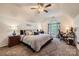 Spacious main bedroom with ceiling fan, office space and large window at 9517 Harris Glen Dr, Charlotte, NC 28269