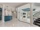 Basement featuring a bar, lounge, fireplace, and access to a staircase and pool at 102 Eastham Ct, Mooresville, NC 28117