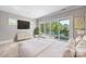 Airy bedroom boasting a view of the lake and balcony access at 102 Eastham Ct, Mooresville, NC 28117