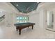 Recreation room with a pool table and scenic lake views at 102 Eastham Ct, Mooresville, NC 28117