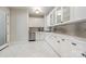 Modern kitchenette featuring white cabinets, sleek countertops, and stainless steel appliances at 102 Eastham Ct, Mooresville, NC 28117