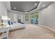 Bright main bedroom features balcony access, and scenic water views at 102 Eastham Ct, Mooresville, NC 28117