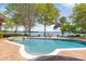 Inviting pool with jacuzzi and lake views, perfect for relaxing and entertaining outdoors at 102 Eastham Ct, Mooresville, NC 28117