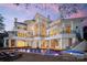 Stunning outdoor pool area with spa, lounge chairs, and multi-level balconies on a modern luxury home at 102 Eastham Ct, Mooresville, NC 28117