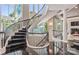 Elegant spiral staircase with iron railing, carpeting and view of lake at 102 Eastham Ct, Mooresville, NC 28117