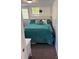 Comfortable bedroom with a queen-size bed, stylish turquoise bedding, and plenty of natural light at 104 Powder Horn Trl # C92, Mount Gilead, NC 27306