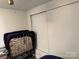 Bedroom space with a fold-out bed and ample storage space at 104 Powder Horn Trl # C92, Mount Gilead, NC 27306