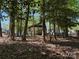 Exterior view of wooded lot featuring mature trees, offering a serene and private setting at 104 Powder Horn Trl # C92, Mount Gilead, NC 27306