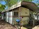 Park model home with carport, grill, patio and A/C unit at 104 Powder Horn Trl # C92, Mount Gilead, NC 27306