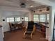 Bright room with built in shelving, a dedicated workspace, and natural light from multiple windows at 104 Powder Horn Trl # C92, Mount Gilead, NC 27306