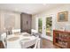 Dining room with patio access, a large wardrobe, and hardwood flooring at 1043 Nancy Dr, Charlotte, NC 28211