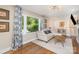 Comfortable and inviting living room with hardwood flooring and bright natural light from a large window at 1043 Nancy Dr, Charlotte, NC 28211