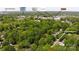 Aerial view of a wooded lot with nearby shopping and Cain Center for the Arts at 10708 Danesway Ln, Cornelius, NC 28031