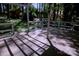 Backyard deck showcasing an outdoor space perfect for entertaining or relaxing in a private, wooded setting at 10708 Danesway Ln, Cornelius, NC 28031