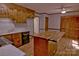 A charming kitchen with wooden cabinets, a butcher block island, and modern appliances at 10708 Danesway Ln, Cornelius, NC 28031