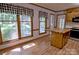 Sunny kitchen nook with a butcher block island, hardwood floors, and a large window, perfect for enjoying meals at 10708 Danesway Ln, Cornelius, NC 28031