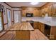 Bright kitchen featuring wood cabinets, white countertops, and a large butcher block island with great workspace at 10708 Danesway Ln, Cornelius, NC 28031