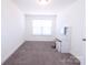 Minimalist bedroom featuring carpet, natural light and a built in vanity at 1075 South Point Rd, Belmont, NC 28012