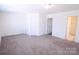 Spacious bedroom features plush carpeting, fresh paint, and ample natural light at 1075 South Point Rd, Belmont, NC 28012