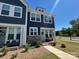 Attractive two-story townhome featuring dark siding, stone accents, and a well-maintained front lawn at 1075 South Point Rd, Belmont, NC 28012