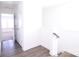 Bright hallway featuring wood-look flooring and access to a sunlit room at 1075 South Point Rd, Belmont, NC 28012