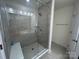 Modern bathroom featuring a glass-enclosed shower with gray tiling and a built-in bench at 1075 South Point Rd, Belmont, NC 28012