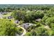 Sprawling aerial view of a home surrounded by lush greenery and mature trees at 11 Secrest Ext, Belmont, NC 28012