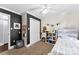 Bedroom featuring dark accent wall, white closet door, and simple stylish decor at 11 Secrest Ext, Belmont, NC 28012