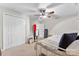 Neutral bedroom with a ceiling fan, and double closet, offering a peaceful retreat for relaxation and rest at 11 Secrest Ext, Belmont, NC 28012