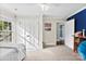 Bedroom showcasing neutral carpet, white doors, and a glimpse into an adjacent space at 11 Secrest Ext, Belmont, NC 28012