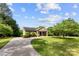 Beautifully landscaped property showcases a well-maintained lawn and mature trees at 11 Secrest Ext, Belmont, NC 28012