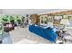 Open living room with brick accent wall, casual seating, and access to the outdoors at 11 Secrest Ext, Belmont, NC 28012