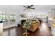 Cozy living room with fireplace, hardwood floors, and open view of the modern kitchen at 11 Secrest Ext, Belmont, NC 28012