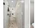 A modern shower boasts marble-style tile, built-in shelves, and sleek, matte-black hardware for a luxurious experience at 11 Secrest Ext, Belmont, NC 28012
