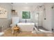 Bright bathroom with free standing tub, herringbone tile shower and luxury finishes at 110 River Wood Dr, Fort Mill, SC 29715