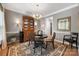 Charming dining room featuring a round table, elegant chandelier, and decorative hutch at 110 River Wood Dr, Fort Mill, SC 29715