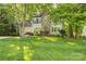 Charming two-story home with a well-manicured lawn and mature trees at 110 River Wood Dr, Fort Mill, SC 29715