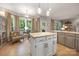 Bright kitchen nook with an island, breakfast bar, and scenic backyard views at 110 River Wood Dr, Fort Mill, SC 29715