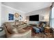Comfortable living room with stylish decor, plush leather sectional, and entertainment center at 110 River Wood Dr, Fort Mill, SC 29715
