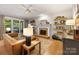 Cozy living room with a brick fireplace, floating shelves, and large windows at 110 River Wood Dr, Fort Mill, SC 29715