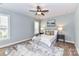 Serene bedroom with a ceiling fan, neutral decor, and ample natural light at 11123 Bailey Park Nature Dr, Cornelius, NC 28031