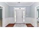 Foyer with hardwood floors and white molding at 11123 Bailey Park Nature Dr, Cornelius, NC 28031