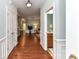 Hallway leading to the living room and kitchen, with a half bathroom to the right at 11123 Bailey Park Nature Dr, Cornelius, NC 28031