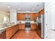 Modern kitchen featuring stainless steel appliances, granite countertops, and wood flooring at 11123 Bailey Park Nature Dr, Cornelius, NC 28031