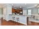Kitchen with granite countertops, a breakfast bar, and modern appliances at 11123 Bailey Park Nature Dr, Cornelius, NC 28031