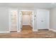 Finished basement with hardwood floors, access to a bathroom, additional storage, and a clean, inviting atmosphere at 112 Circle Dr, Salisbury, NC 28144