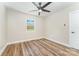 Bedroom with hardwood floors, neutral paint, ceiling fan, and a window providing natural light and a fresh atmosphere at 112 Circle Dr, Salisbury, NC 28144
